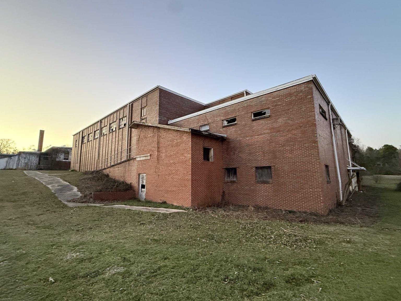 Exterior of the red brick school at golden hour