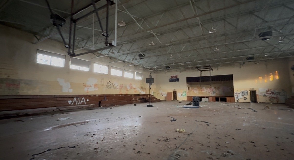 Interior of the gymnasium with trussed ceiling
